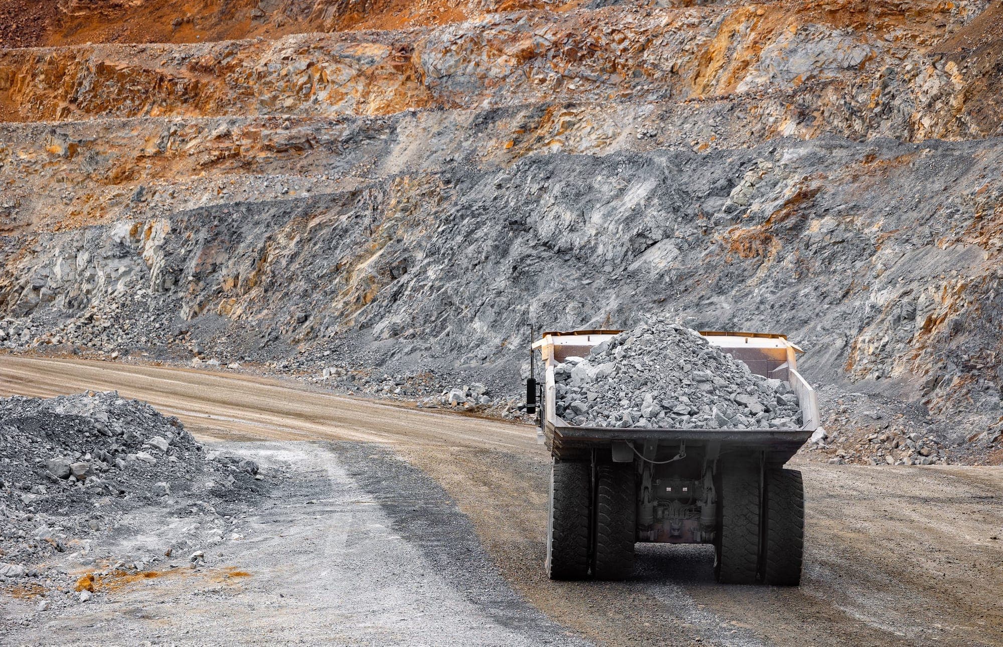 Loaded haul truck on a haul road in an open-pit mine